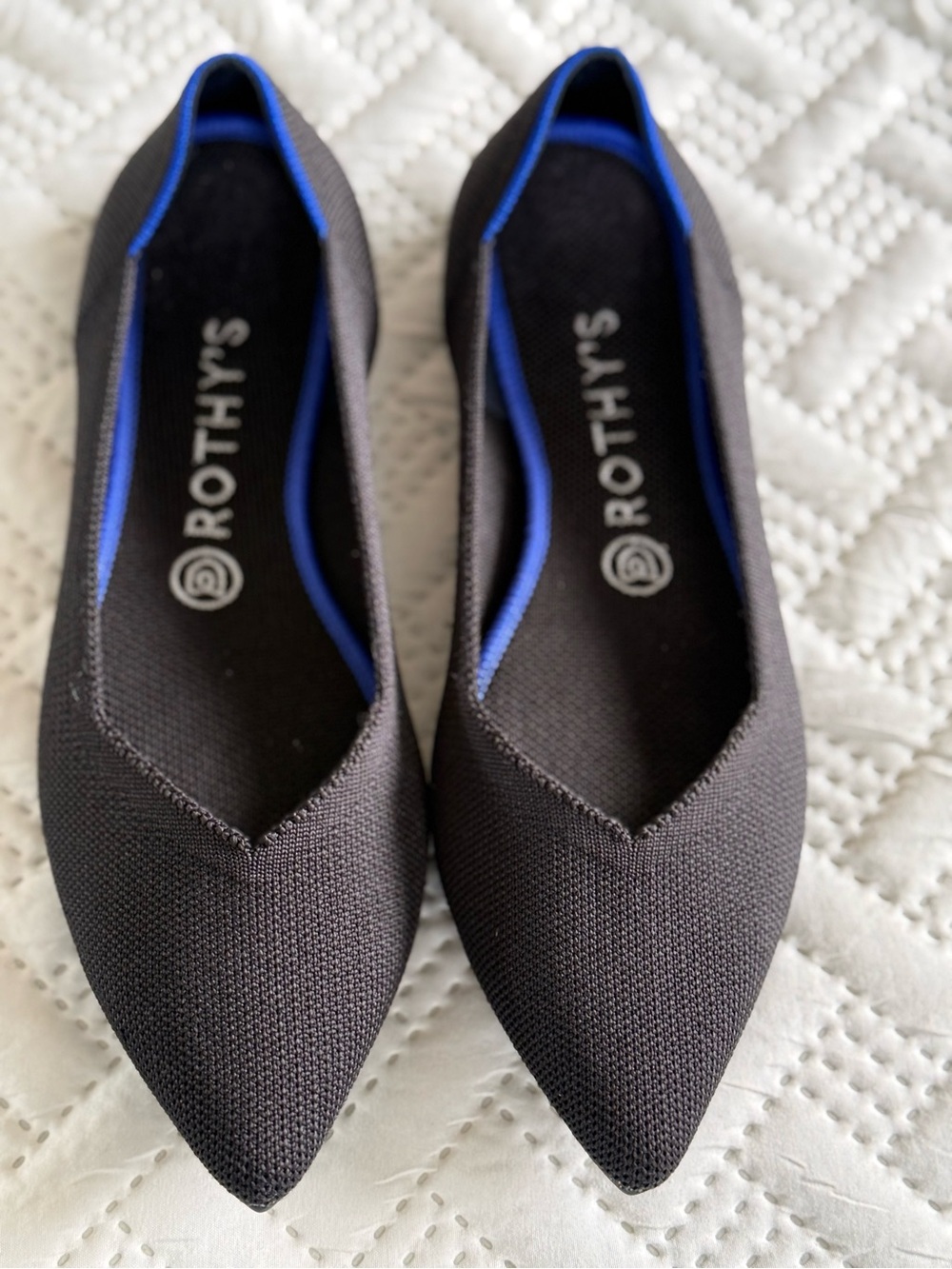 Rothy's Black Pointed Flats with Blue Trim